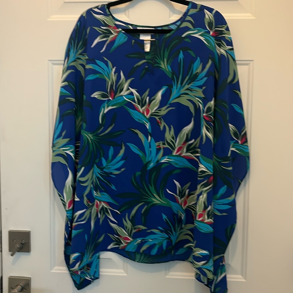 Colorful top with arm holes similar to a cape